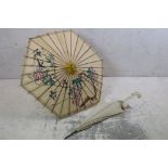 Oriental Paper Parasol together with Early 20th century Cream Parasol with horn handle