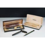 A pair of Rolled Gold Parker pens within original gift case together with a Sheaffer example and two