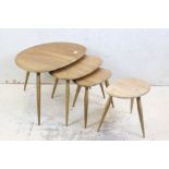 Ercol Nest of Three Elm and Beech Pebble Tables, model no. 354 together with another small Ercol