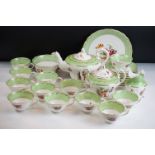 Early 20th Century English porcelain floral tea set in pale green & white with gilt detailing,