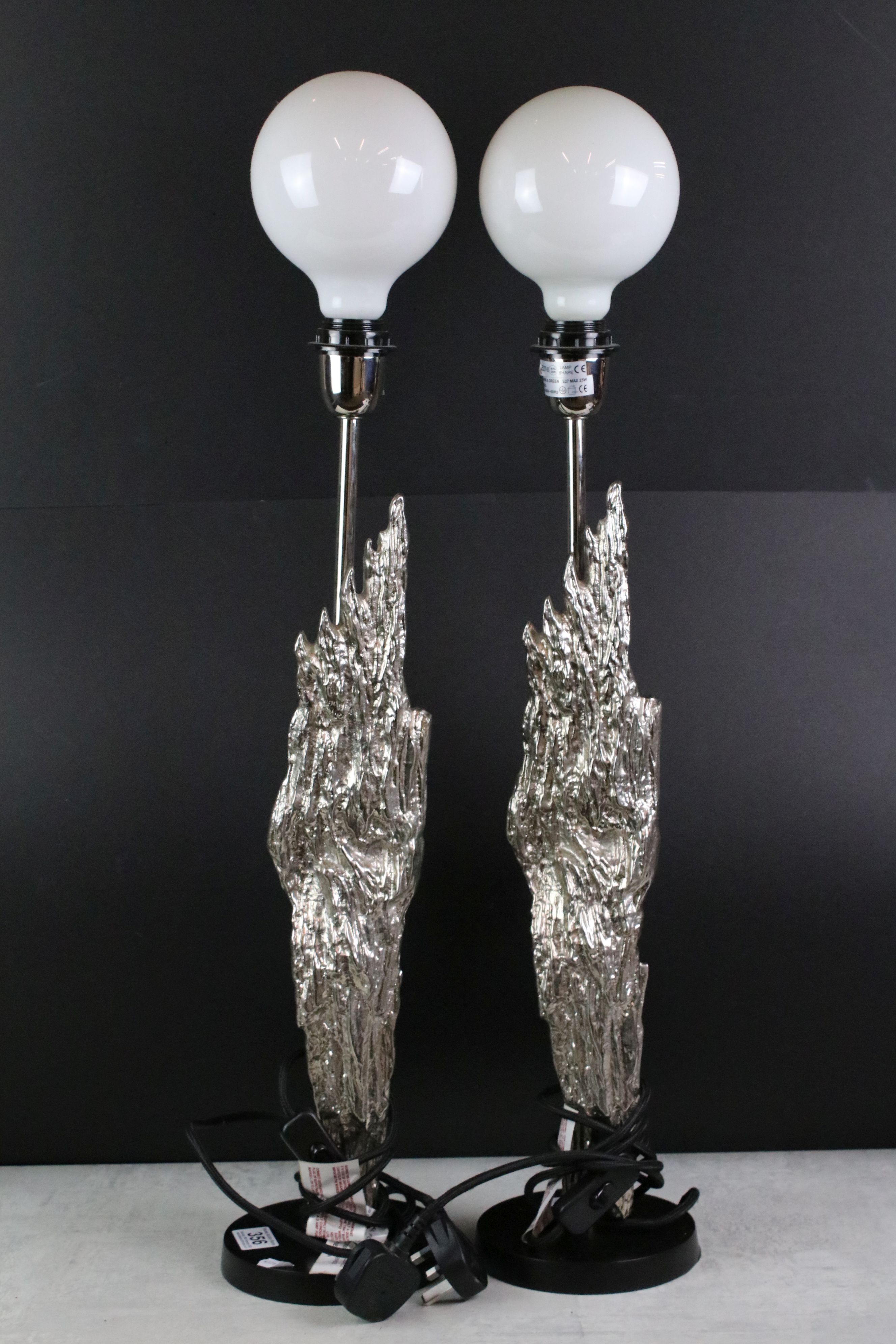 Pair of Table Lamps mounted with a Silvered Flame style decoration, 63cm high