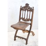 Moorish Hardwood Carved Folding Chair with embossed leather seat, 84cm high x 37xm wide