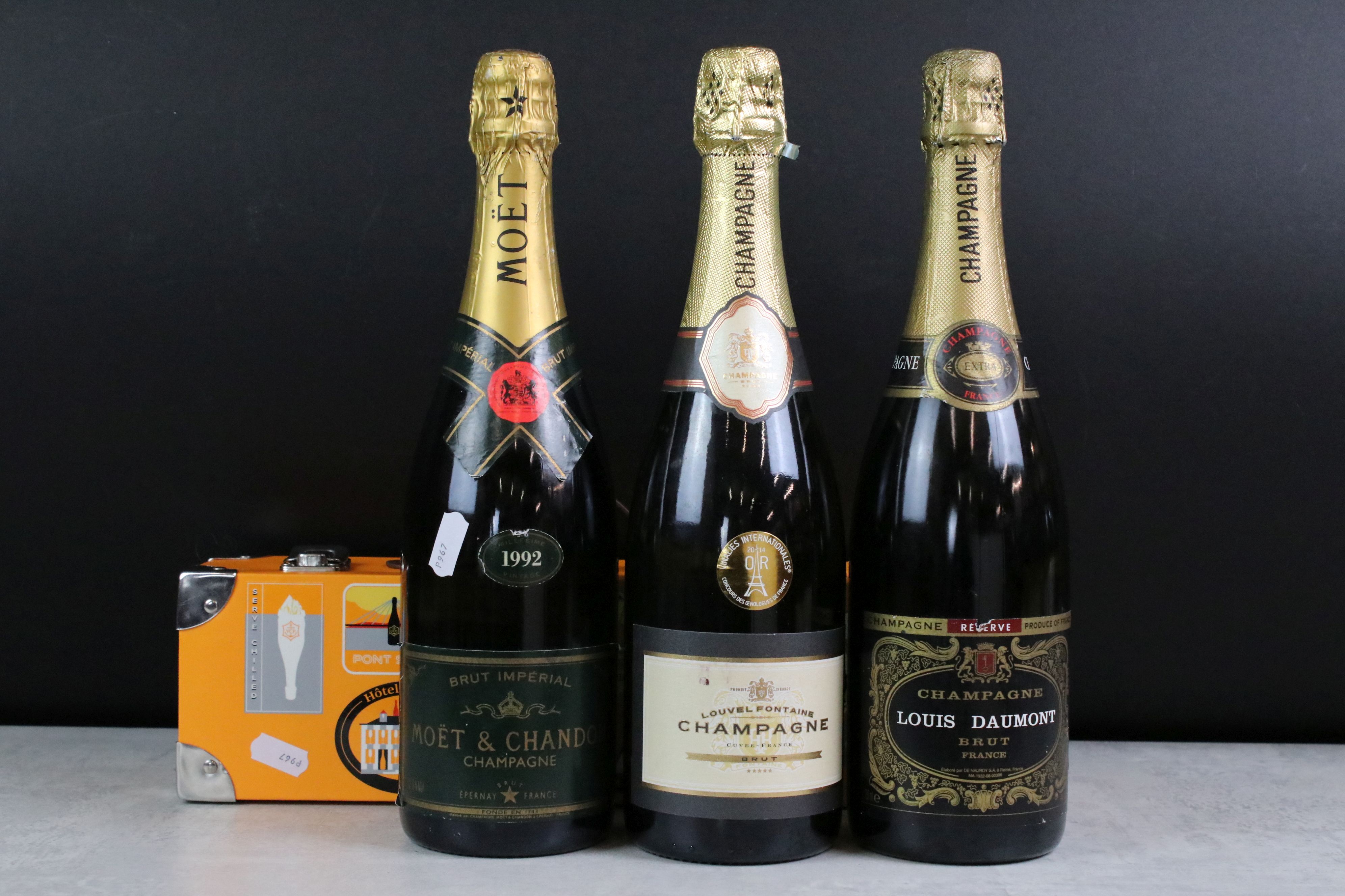 A collection of four bottles of Champagne to include Moet & Chandon, Louis Daumont, Louvel
