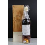 A bottle of Baron De Lustrac Armagnac 1954, sealed bottle within wooden case.