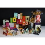 A collection of perfume and make up factory sample packs to include Givenchy, Dolce & Gabbana,