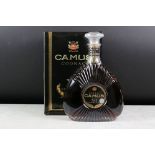 A bottle of Camus XO Superior Cognac, sealed bottle in box.
