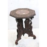 Carved Octagonal Table raised on a South East Asian Tripod Hardwood Base ornately carved with