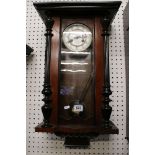 Late Victorian Walnut and Ebonised Wall Clock, the white enamel dial with Arabic numerals, 69cm high