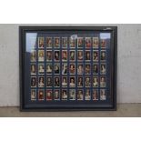 Framed Collection of 1930's Players Cigarette Cards portraying Kings and Queens of England 1066 -