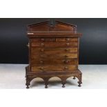 Hardwood Table Top Collector's Cabinet in the form of an 18th century Chest of two short over five