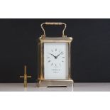A brass cased carriage clock with bevelled glass panels, Garrard & Co. London.