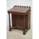 Victorian Rosewood Davenport, with pierced carved gallery rail, the sloping leather inset lid