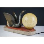 Art Deco Lamp in the form of a Bronze effect Swan and a mottled yellow glass shade, raised on a