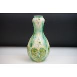 Della Robbia Pottery (Birkenhead 1894-1906) Bulb shaped Vase with painted leaf decoration in