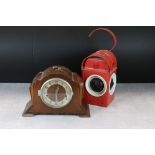 An Art Deco wooden case Enfield mantle clock together with a road workers warning lamp.