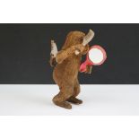 An Antique Tin & Mohair Monkey with Comb & Mirror Wind Up Toy.