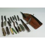 A collection of vintage pocket knives, pen knives and a sheath / scouting knife.