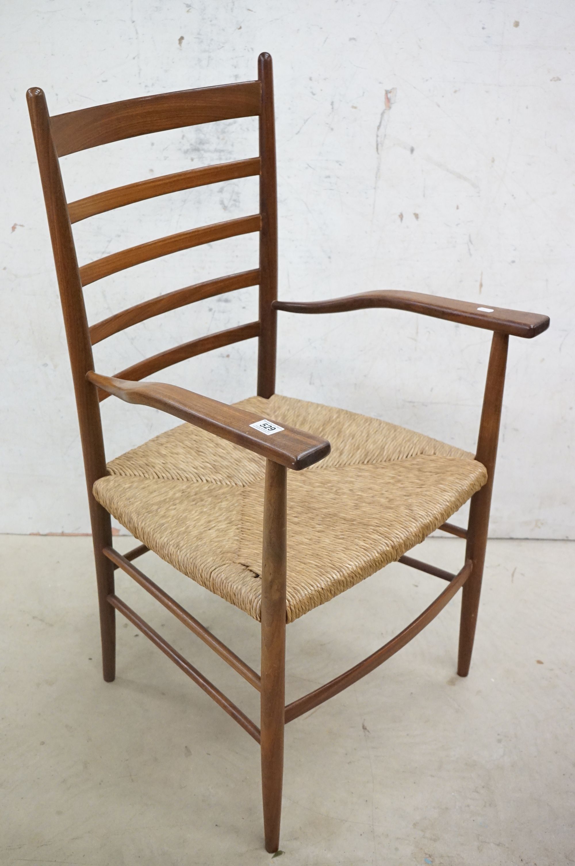 In the manner of Scadart, Pair of Mid century Retro Teak Ladder Back Elbow Chairs with rush seats, - Image 8 of 11