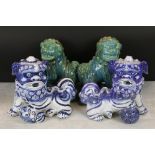 Two Pairs of Chinese Ceramic Dogs of Fo, one pair with green mottled glazed, 29cm high and the other