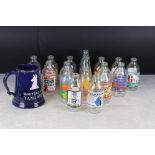 A collection of vintage Unigate advertising milk bottles.