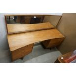 Mid century Retro Teak Dressing Table of curved form with long dressing mirror and six drawers,