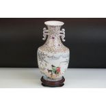 20th century Chinese Porcelain Twin Handled Vase decorated with a scene of a Figures and a Donkey on
