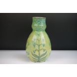 Della Robbia Pottery (Birkenhead 1894-1906) Bulb shaped Vase with incised flower decoration in