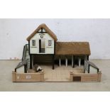 A scratch built model farm yard stable block, built by Ted Baker WW2 veteran, plaque to front with