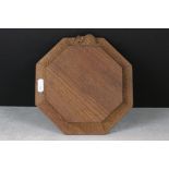 In the manner of Mouseman, Carved Oak Octagonal Cheese Board with mouse carved to side, 19cm wide