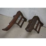 Musgrave of Belfast, Two 19th century Teak and Cast Iron Saddle Racks, both stamped to underside,