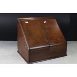 Late 19th / Early 20th century Walnut Stationery Cabinet, the two sloping doors opening to a