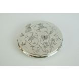 Silver Circular Compact, the lid with engraved decoration of flowers and butterflies, London 1947