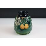 Moorcroft Baluster Vase decorated in the passion fruit pattern, dated 97 to base, 15.5cm high
