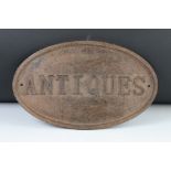 Cast Iron Oval ' Antiques ' Sign, 35cm long