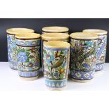 Seven Persian style Pottery Vases decorated with flowers and birds, tallest 27cm