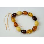 A Baltic Amber bracelet with olive shaped beads.