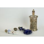 A fully hallmarked sterling silver pierced cased scent bottle together with a blue glass and a