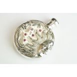 Perfume Bottle with embossed sun decoration set with rubies, stamped