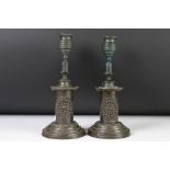 Pair of Victorian Bronze Candlesticks decorated with roundels of flowers, 21cm high