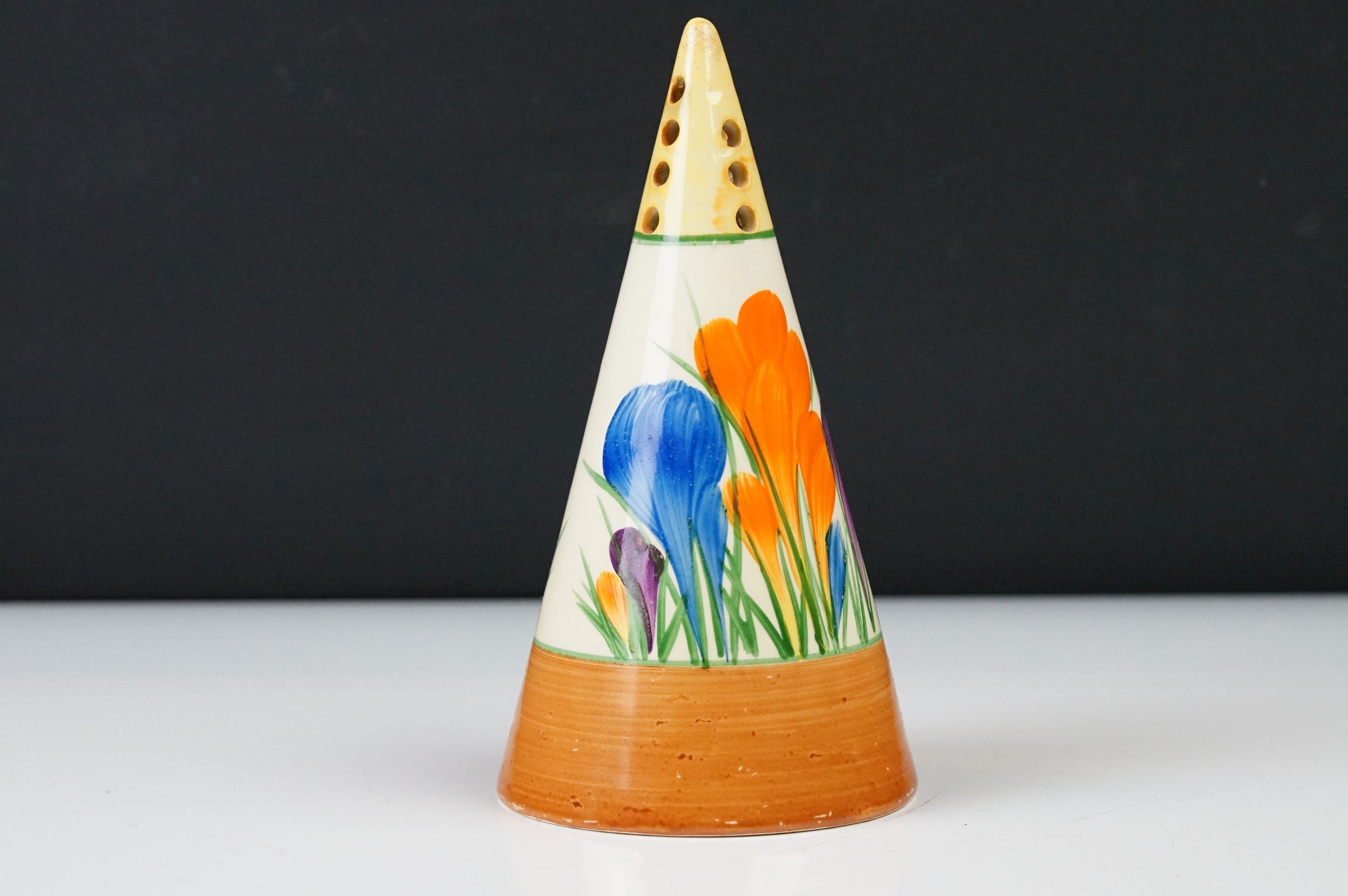 Clarice Cliff Pottery Bizarre Conical Sugar Shaker in the crocus pattern, 14cm high