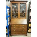 George III Mahogany Bureau Bookcase, the upper section with two astrgal glazed doors opening to