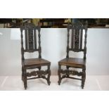 Pair of Oak Hall Chairs in the 17th century Carolean manner, the high backs heavily carved including