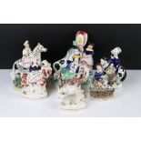 Six 19th century Staffordshire Figures including two seated on goats together with a Rockingham type