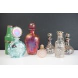 A small collection of mixed scent bottles to include Isle of Wight glass and silvered examples.