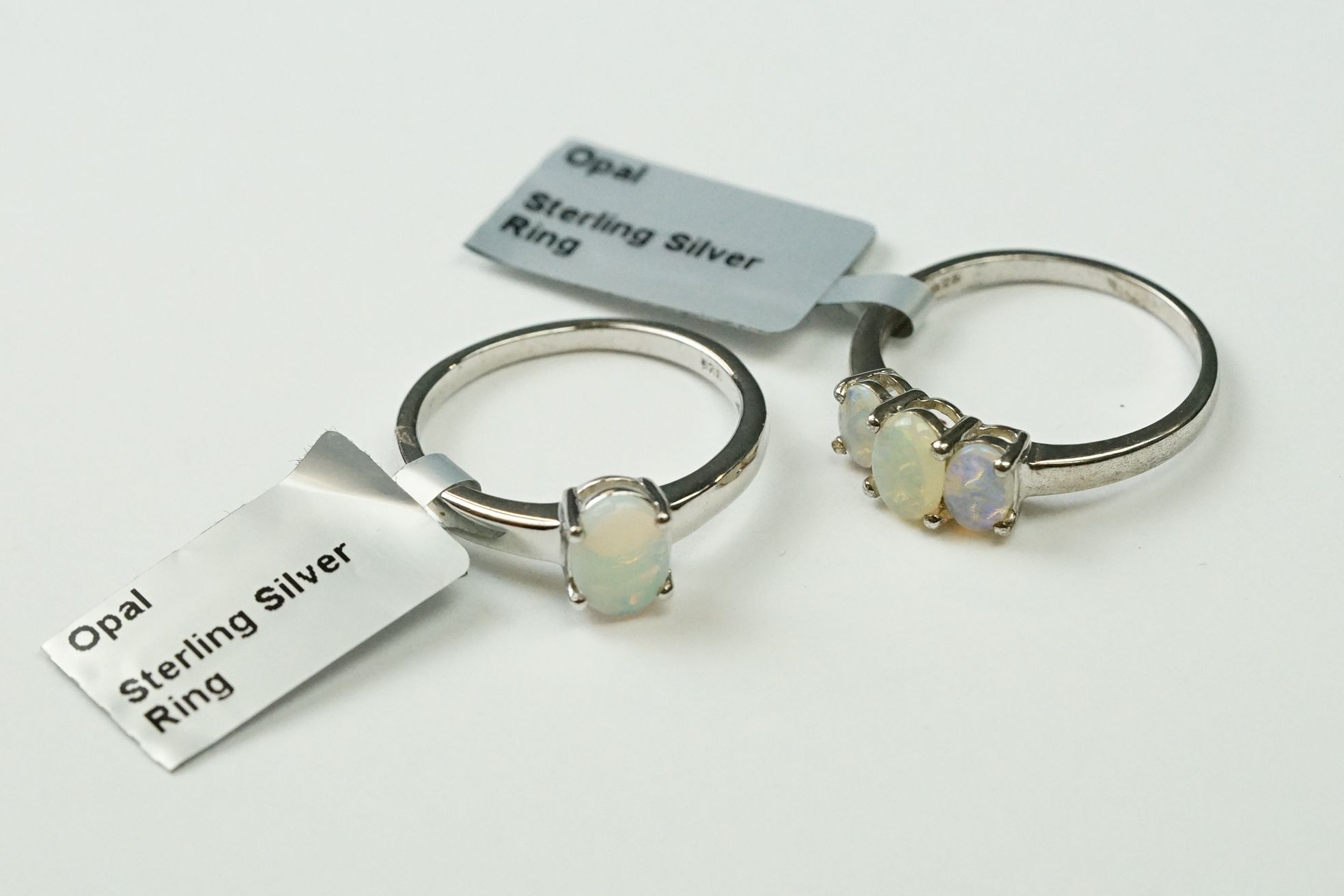 Two sterling silver ladies dress rings set with Opal cabochons.
