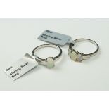 Two sterling silver ladies dress rings set with Opal cabochons.