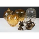 Three amber glass textured lamp shades together with a clear example and a quantity of fittings.