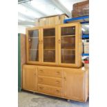 Ercol Light Elm Bookcase / Display Cabinet with three bevelled glazed doors opening to adjustable