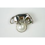 Silver Brooch in the form of a cat balancing a pearl
