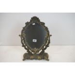 Cast Brass Framed Rococo style Oval Swing Mirror, 31cm wide x 50cm high